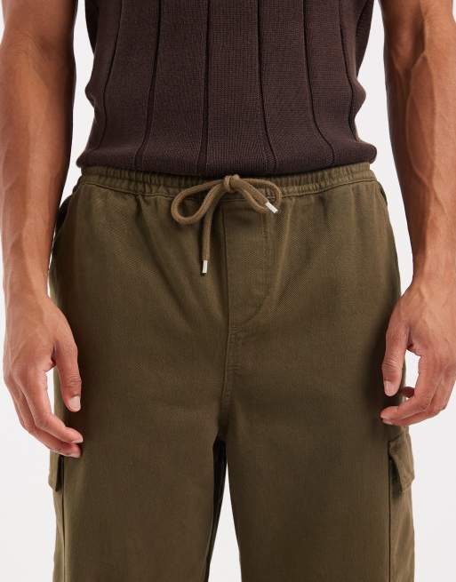 Pantalones cargo caquis de corte tapered sin cierres de ASOS DESIGN, 5 de 5