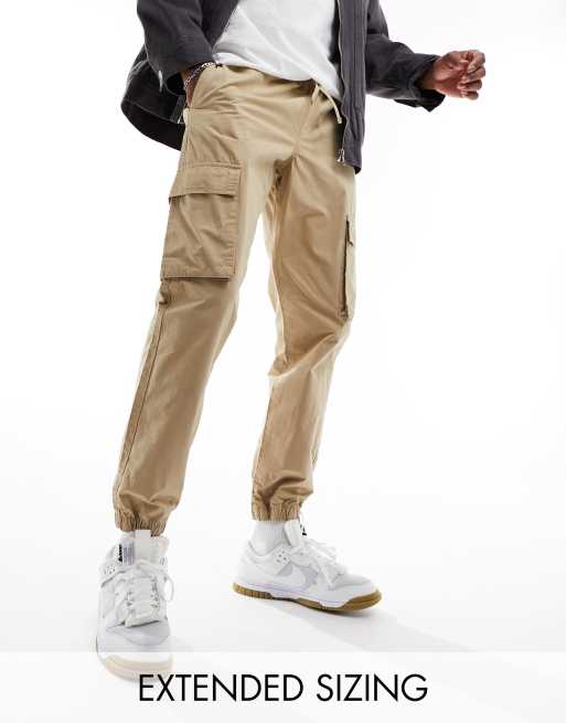 Pantalones cargo color piedra lavado de corte tapered sin cierres con cintura elástica de ASOS DESIGN