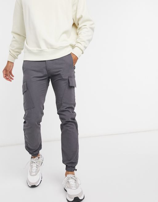 Pantalones cargo de corte slim con bajo con cierre tipo trenca en negro ripstop de ASOS DESIGN
