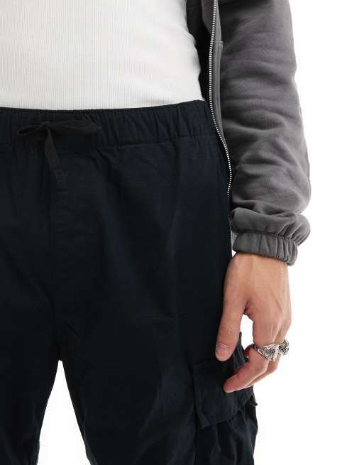 Pantalones cargo negros de corte ancho de tejido antidesgarros de Jack & Jones, 5 de 5