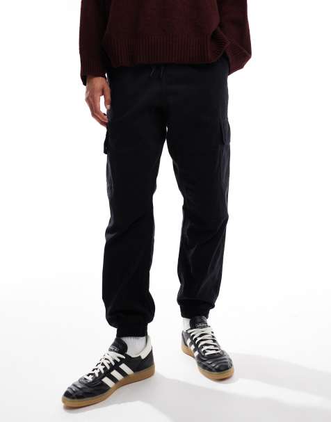 Pantalones cargo negros de corte slim con bajos ajustados de New Look - view 1