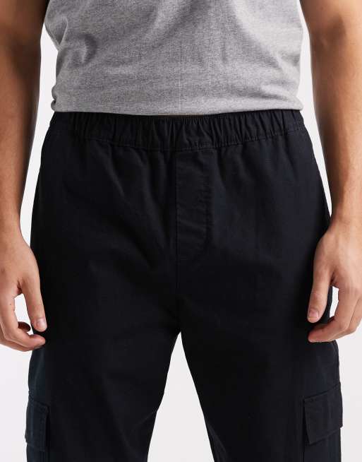 Pantalones cargo negros de corte tapered de tejido antidesgarros de ASOS DESIGN, 5 de 5
