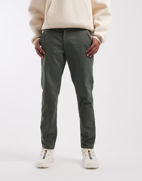 Pantalones chinos caquis cómodos elásticos de corte tapered de ASOS DESIGN - view 1