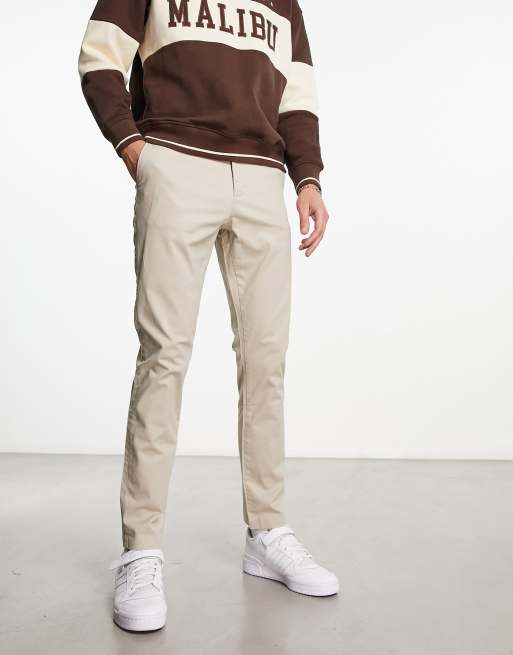 Pantalones chinos color piedra de corte pitillo de New Look