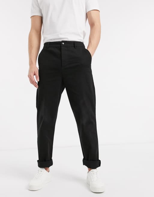 Pantalones de corte skater holgado en negro ASOS | ASOS