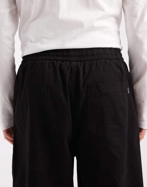 Pantalones chinos negros de corte barrel con cordón ajustable de Jack & Jones, 4 de 5
