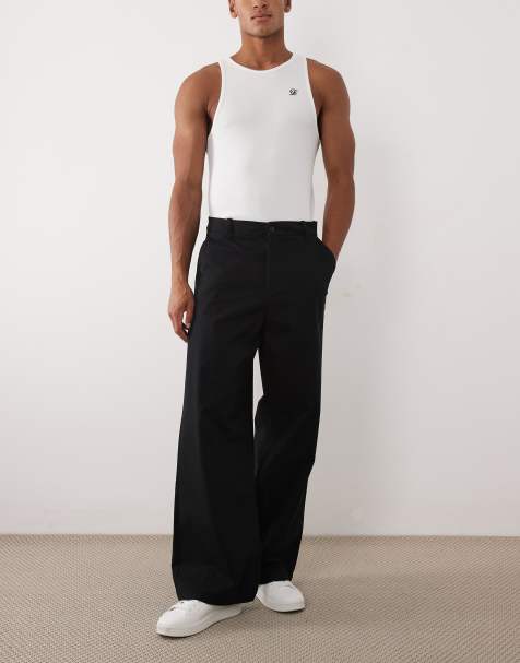 Pantalones chinos negros de corte suelto de ASOS DESIGN - view 1