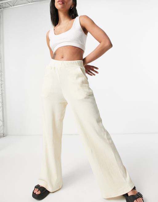 Pantalones color crema de campana de canalé de punto de Lasula (parte de un conjunto)