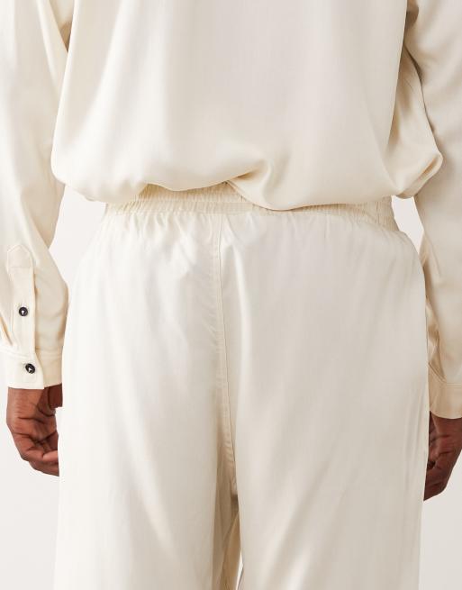 Pantalones color crema de corte tapered de ASOS DESIGN (parte de un conjunto), 5 de 5