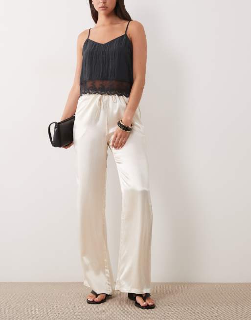 Pantalones color crema de pernera ancha con cordón ajustable de satén de SNDYS