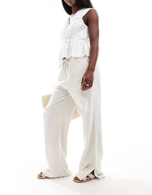 Pantalones color crema de pernera ancha con cordón ajustable en la cinturilla de mezcla de lino de PIECES