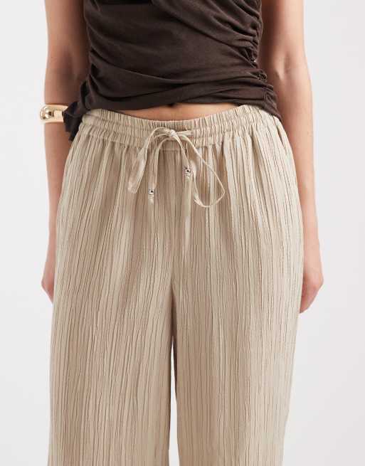 Pantalones color piedra de pernera ancha de tejido texturizado rugoso de ONLY, 3 de 5