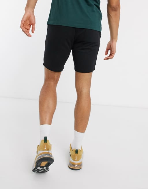 Pantalones cortos de punto en negro con triángulo de ASOS DESIGN | ASOS