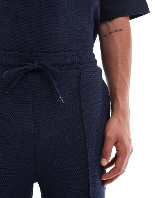 Pantalones cortos azul marino de corte slim extragrande de ASOS DESIGN, 3 de 5