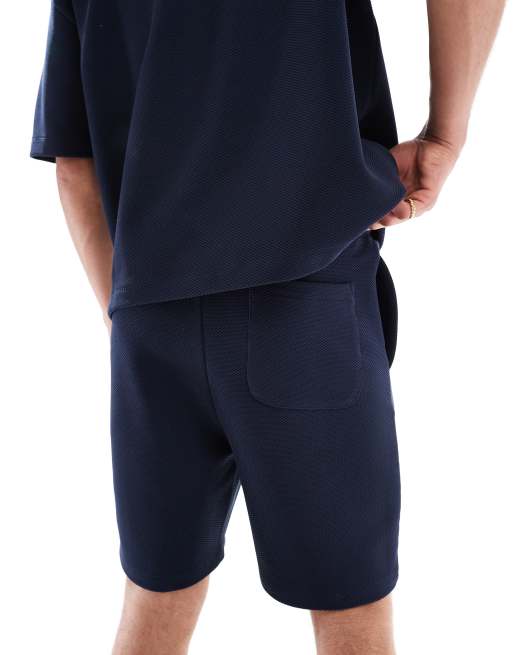 Pantalones cortos azul marino de corte slim extragrande de ASOS DESIGN, 4 de 5