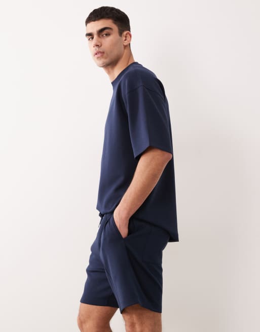 Pantalones cortos azul marino extragrandes con jaretas de punto liso de ASOS DESIGN, 3 de 5