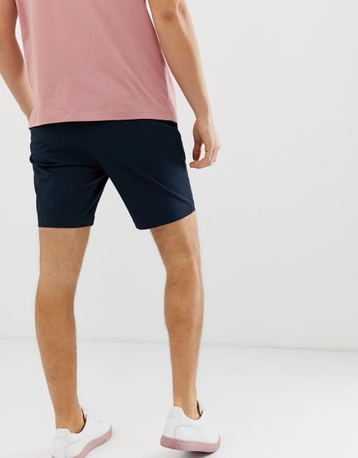 Pantalones cortos chinos de corte slim diseño elástico en azul marino de Original Penguin | ASOS