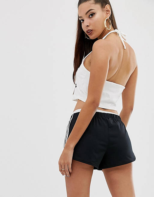 20 % de descuento Mujer Ropa de Shorts de Minishorts Pantalones cortos con tres rayas en adicolor adidas Originals de color Negro 