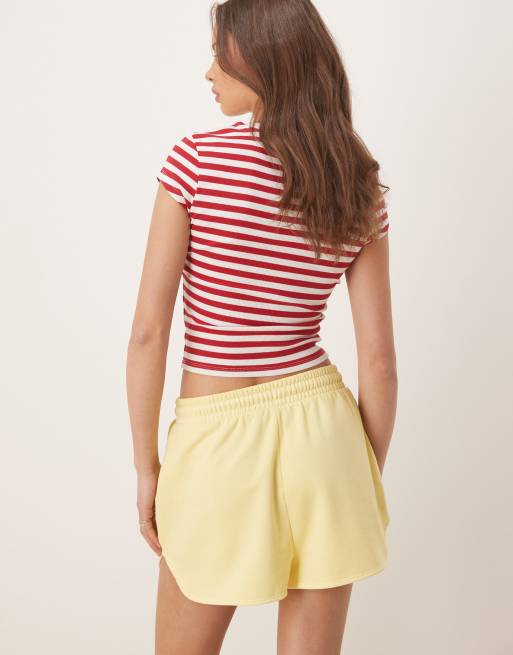 Pantalones cortos de chándal amarillo lavado de estilo deportivo de ASOS DESIGN, 5 de 5