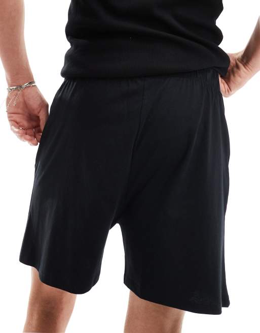 Pantalones cortos de estar por casa negros de punto liso de ASOS DESIGN, 5 de 5