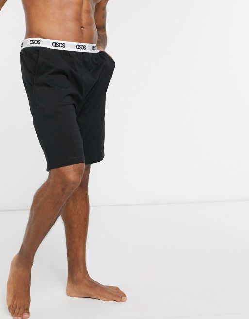 Pantalones cortos de pijama confort en negro con cinturilla con detalle de la marca de ASOS DESIGN