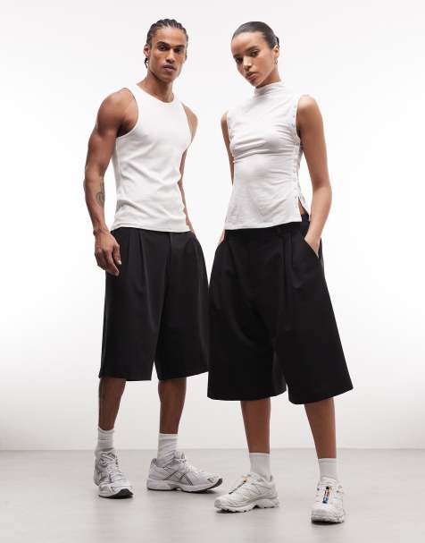 Pantalones cortos de sastre negros de corte alargado de COLLUSION Unisex - view 1