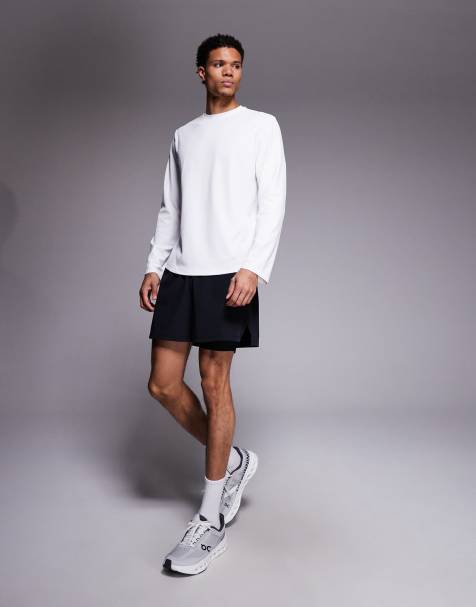 Pantalones cortos deportivos negros para correr con diseño 2 en 1 y bolsillo para teléfono con cremallera de 4505 - view 1