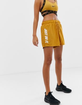 pantalones nike dorados