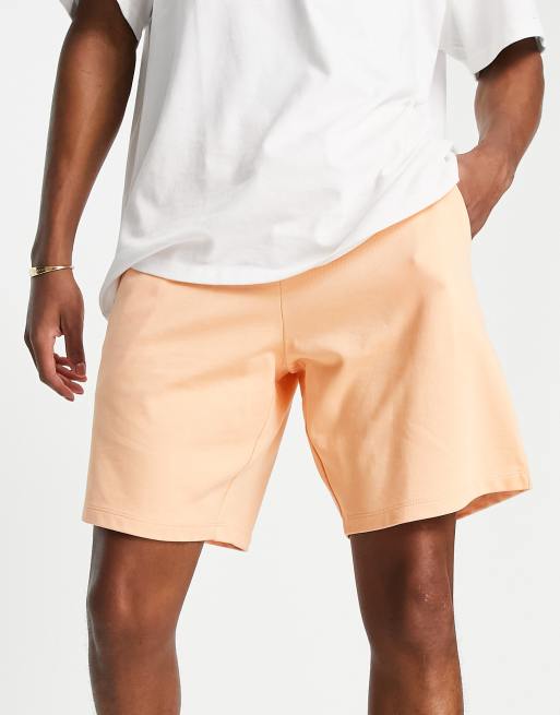 cortos extragrandes con lavado naranja de punto de ASOS | ASOS