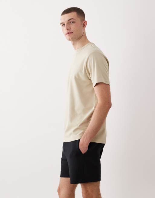 Pantalones cortos negros básicos de corte slim de punto liso Essentials de ASOS DESIGN, 3 de 5