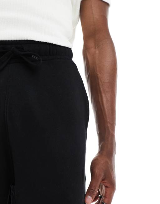 Pantalones cortos negros básicos extragrandes de largo medio de ASOS DESIGN, 3 de 5