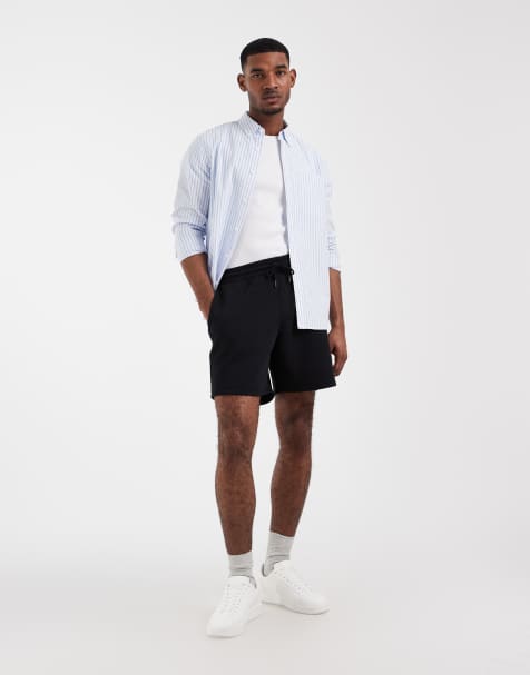 Pantalones cortos negros básicos extragrandes de largo medio de punto liso Essentials de ASOS DESIGN - view 1