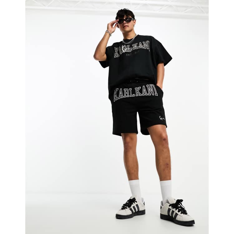 Pantalones cortos negros con diseno universitario de tejido grueso de Karl Kani parte de un conjunto ASOS