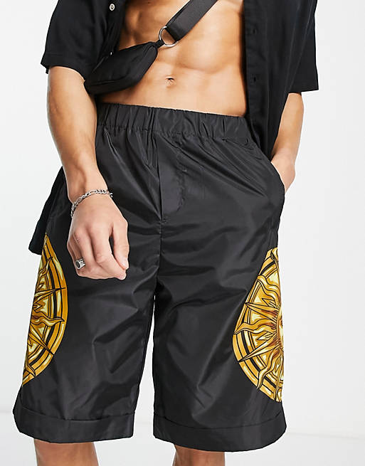 Hombre Other | Pantalones cortos negros con estampado de sol de nailon de Versace Jeans Couture - FA89314