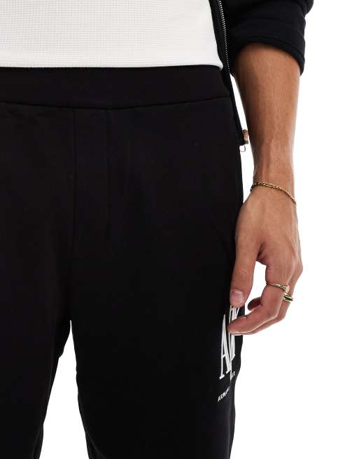 Pantalones cortos negros con logo de punto liso de Armani Exchange, 3 de 5
