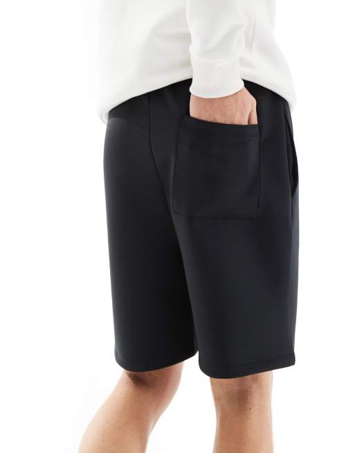 Pantalones cortos negros de corte slim de tejido efecto neopreno de ASOS DESIGN, 4 de 5