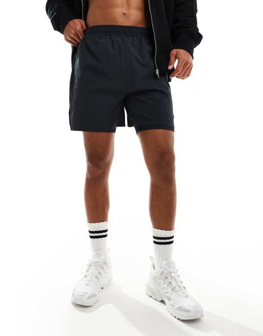Pantalones cortos negros deportivos para correr con diseño 2 en 1 y bolsillo para teléfono de canalé de 4505 
