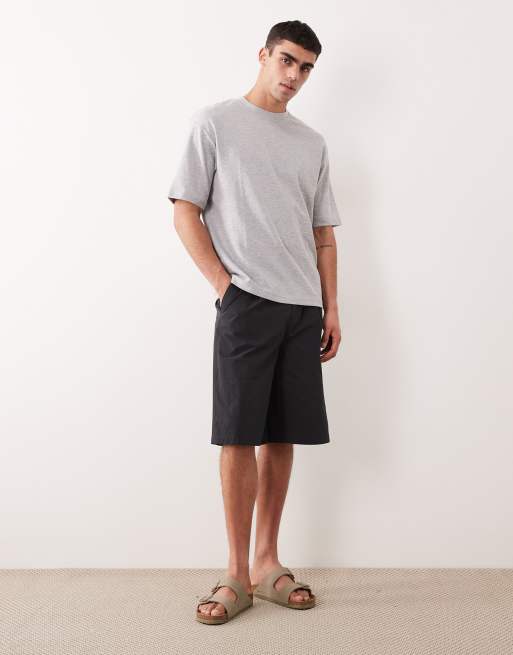 Pantalones cortos negros elásticos de corte alargado con pinzas de ASOS DESIGN, 4 de 6