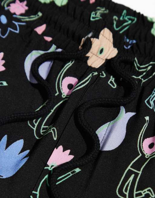 Pantalones cortos negros unisex de corte slim con estampado PRIDE de ASOS DESIGN (parte de un conjunto), 3 de 5