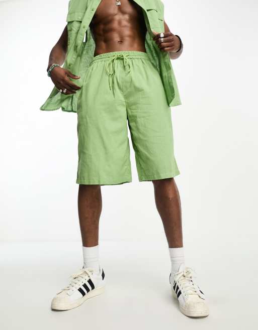 Pantalones cortos playeros verde claro de lino de COLLUSION