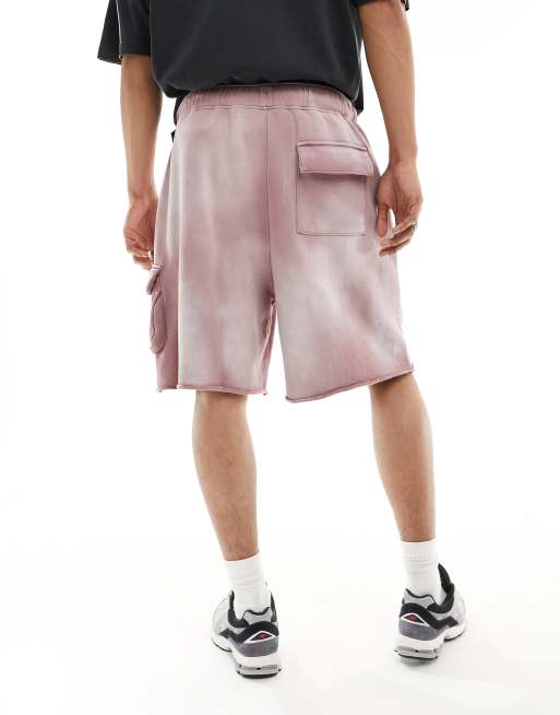 Pantalones cortos rosa lavado cargo extragrandes unisex con bajos sin rematar de ASOS DESIGN, 4 de 5