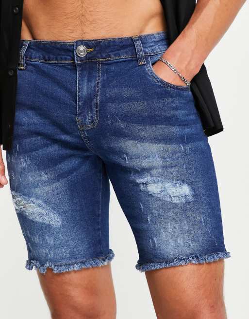 Pantalones cortos vaqueros azul añil con bajos deshilachados de Night Addict