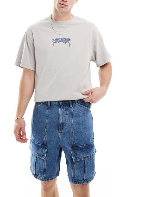Pantalones cortos vaqueros azules de corte estándar con lavado medio y diseño de paneles de ASOS DESIGN