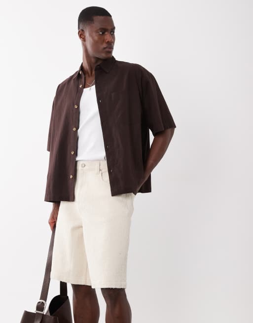Pantalones cortos vaqueros color crudo de corte alargado estilo bermudas de tejido texturizado de ASOS DESIGN, 1 de 5
