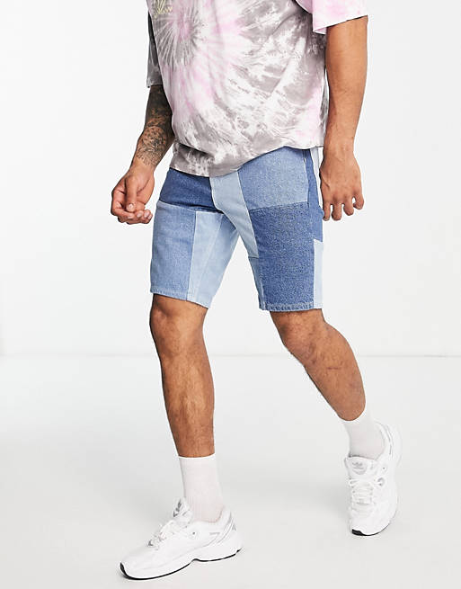 Hombre Other | Pantalones cortos vaqueros de corte slim con diseño de patchwork y lavado medio de ASOS DESIGN - PC12695