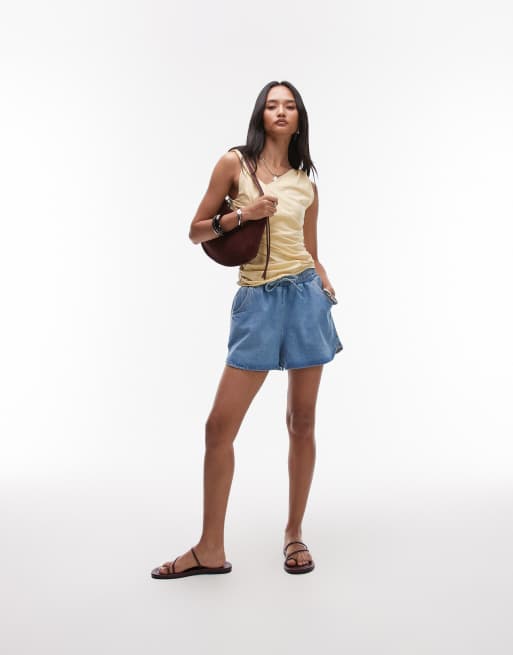 Pantalones cortos vaqueros de estilo deportivo sin cierres de Topshop