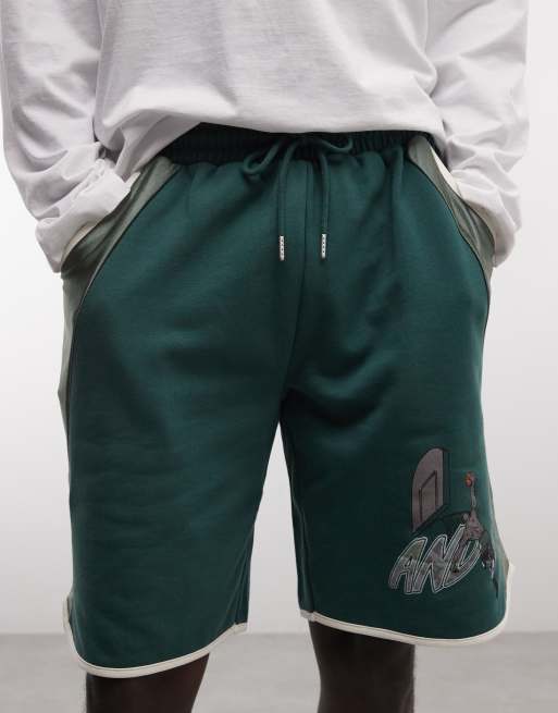 Pantalones cortos verde oscuro de estilo baloncesto con paneles en contraste de AND1, 4 de 5