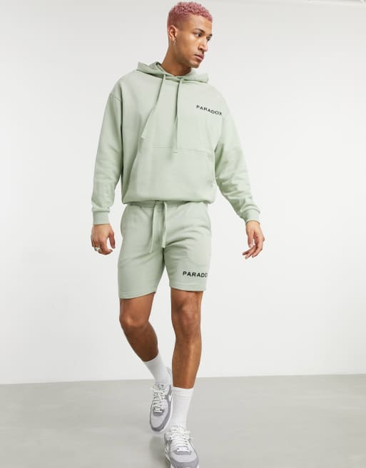 Chándal con estampado de texto en pequeño de ASOS DESIGN, 2 de 3