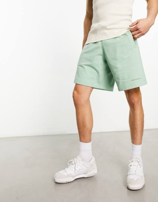 Pantalones cortos verdes Athletics State de New Balance
