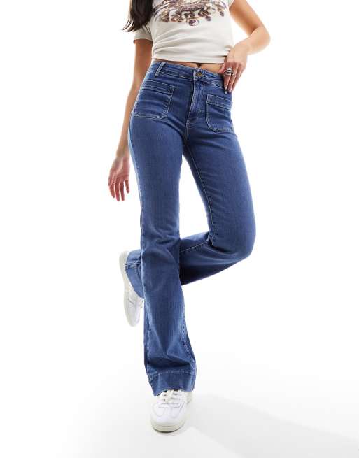 Pantalones de campana azul medio de talle muy alto con bolsillos delanteros de Wrangler